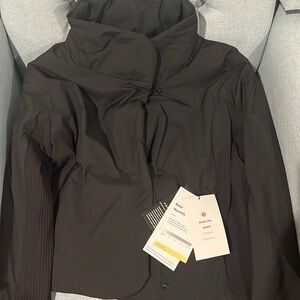 Brand new with tags black Lululemon sleek city jacket size 10